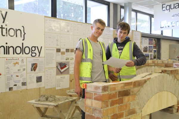 Cornwall College construction students, learning how to lay bricks in a workshop
